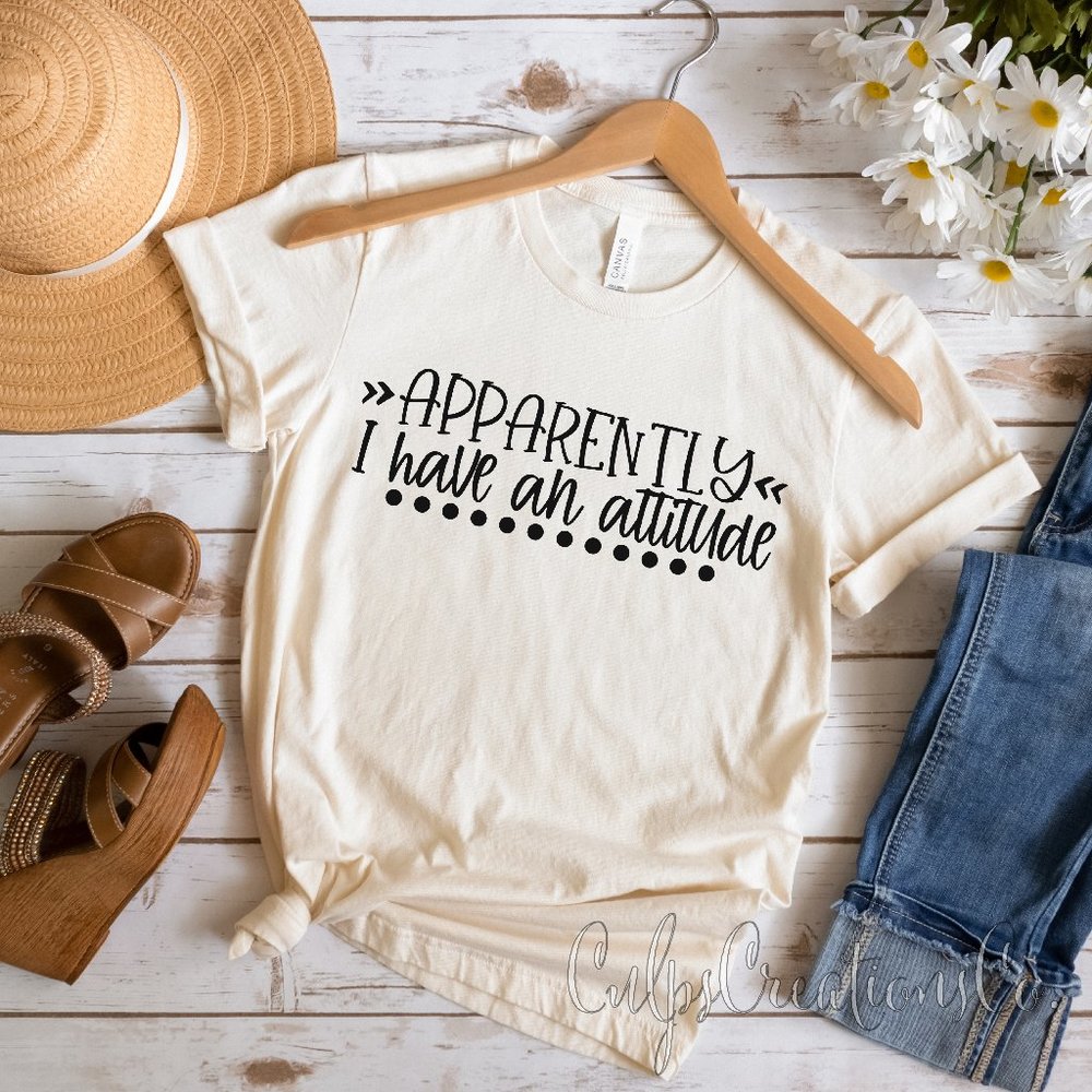 Apparently I have an attitude cream soft heather short sleeve womens graphic tee